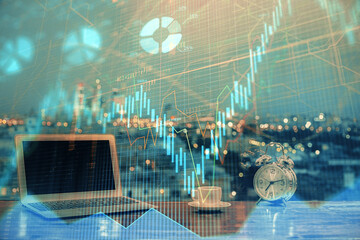 Double exposure of forex chart and work space with computer. Concept of international online trading.