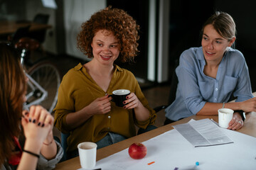 Businesswomen working on a new project. Colleagues discussing about problem they have to solved.