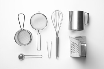 Set of modern cooking utensils on white background, top view