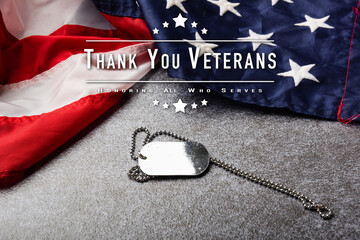 America United States flag and chain dog tags, military symbolizing, studio shot on concrete board...