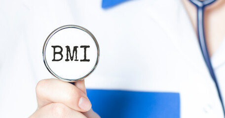 Doctor holding a stethoscope with text BMI, medical concept