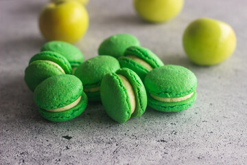 Macaroons. Delicious french desserts. Macaroons on the table. Macaroons with cream cheese and apples