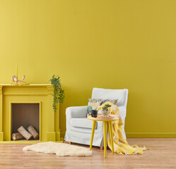 Yellow wall room, fireplace and armchair, green interior plant, orange lamp and clock style.