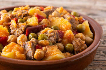 Ropa vieja food in bowl on wooden table. Close up	