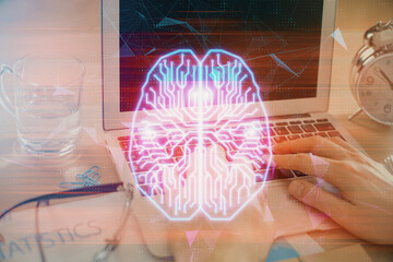Man typing on keyboard background with brain hologram. Concept of big Data.