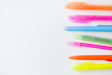 colorful felt pens on the white background. Flat lay top-down