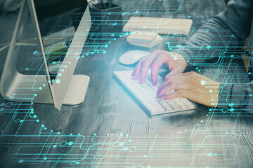 Double exposure of tech drawings with hands working on computer background. Concept of innovation.