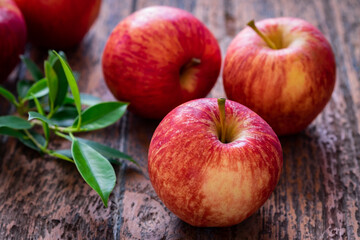 Red apples on wooden table