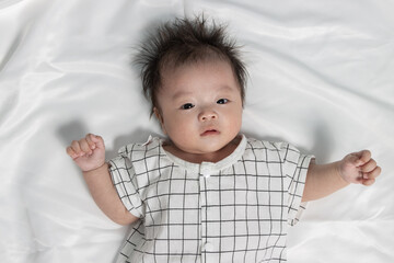 Portraiture image of Three month old Asian Cute little baby boy lsolated on white background