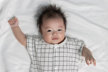 Portraiture image of Three month old Asian Cute little baby boy lsolated on white background