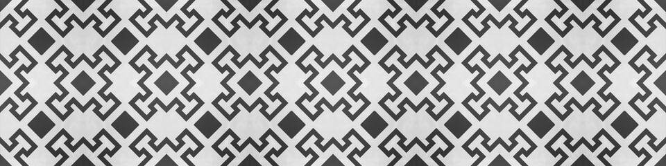 Old geometric black and white vintage shabby patchwork mosaic tiles stone concrete cement wall texture background banner, with diamond rue lozenge square print