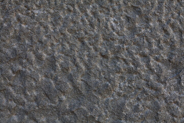 Background image - textured wall made of diabase (stone harder than granite)