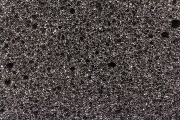 Foam rubber.Gray black background texture paralon