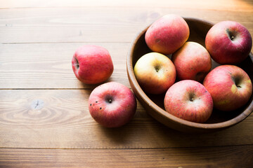 ripe apples on a wooden background
