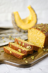 Gluten Free Pumpkin bread loaf set white cafe table.