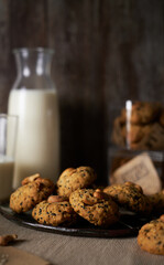 Oatmeal sesame cookies. Healthy homemade dessert decorated with sesame seeds. set on rustic wooden background.