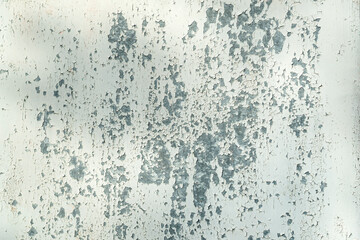 White flaky paint on a metal surface. Texture background