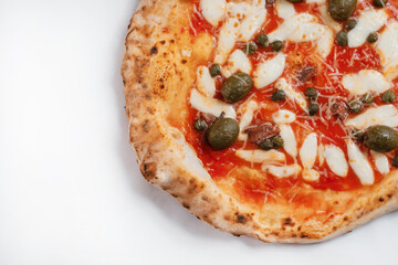 Italian pizza with anchovy and capers on a white background. Copy space.
