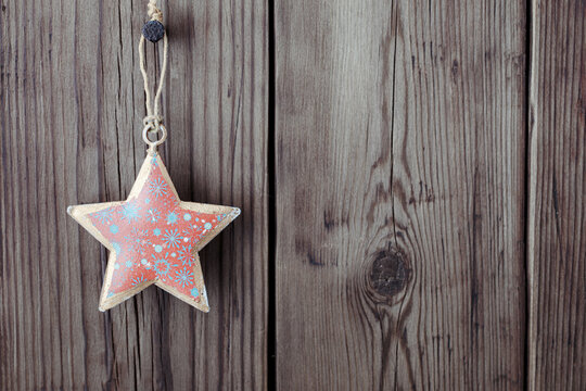Wooden background with vintage Christmas star with copy space for text
