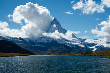 Matterhorn mountain view from Stellisee lake in Switzerland Zermatt beautiful weather and clouds