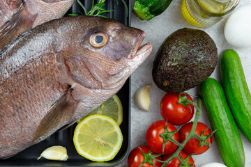 Balanced diet nutrition keto concept. Assortment of healthy ketogenic low carb food ingredients for cooking. Vegetables, meat, fish, cheese and eggs. Top view.