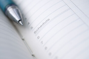 open notepad with schedule word on paper 