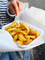 London, England - August 31, 2008: Woman Eating a Portion of Chips