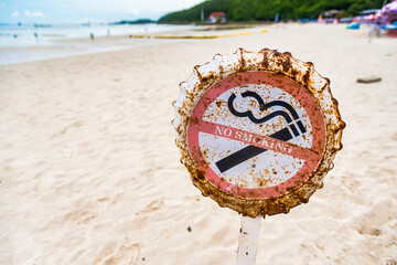 No smoking signs on Tawaen Beach in Koh Larn, Chon Buri, Thailand. Laws of Thailand prohibit smoking on beaches throughout the country.