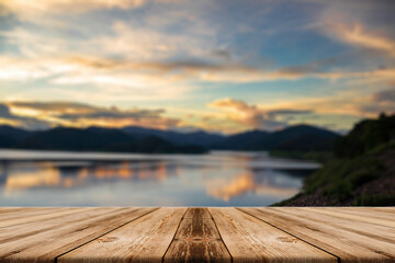 Fototapeta na wymiar Showcase an old wooden table shelf on a beautiful sunset and blurred nature background.