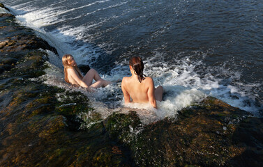 Two naked women enjoys nature