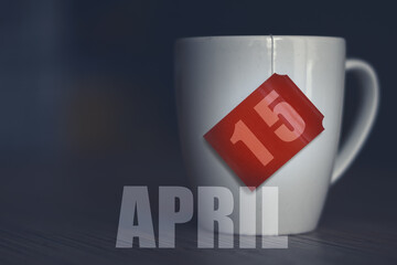 april 15th. Day 15 of month,Tea Cup with date on label from tea bag. spring month, day of the year concept