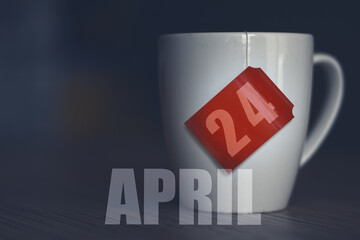 april 24th. Day 24 of month,Tea Cup with date on label from tea bag. spring month, day of the year concept