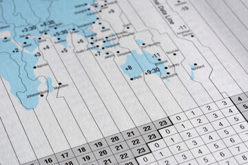 Closeup International time zone on white paper map.