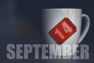 september 14th. Day 14 of month,Tea Cup with date on label from tea bag. autumn month, day of the year concept