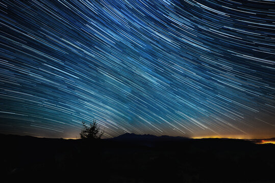 beautiful landscape with valleys, lakes and rivers with startrails