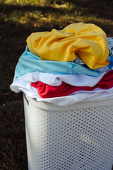 A stack of dirty laundry in a basket