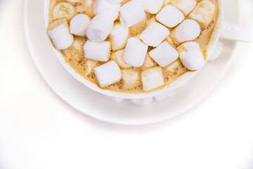 Coffee with marshmallows on a white background.Hot winter drink.