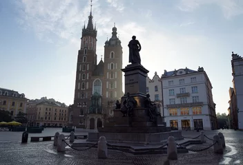 Fototapeten Cracow, the Adam Mickiewicz monument in Main Market Square with St. Mary's Basilica in background © Tomasz