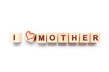 Wooden dice with the phrase I LOVE MOTHER. Mother's Day concept
