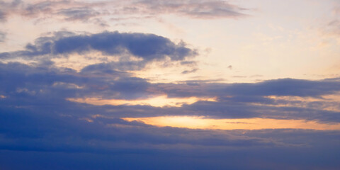 Naklejka na ściany i meble The sky at sunset. Dramatic cloudy sky as background.