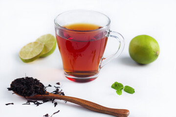 black tea in a transparent glass on the table