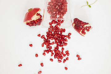 Pomegranate fruit on a white background and mint leaves