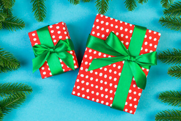 Top view of colorful holiday background made of fir tree and gift box. Happy New Year concept with copy space