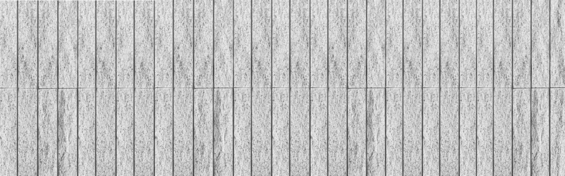 Panorama of Block pattern of white stone cladding wall tile texture and seamless background