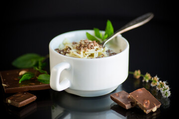 sweet noodles with milk and grated chocolate in a bowl