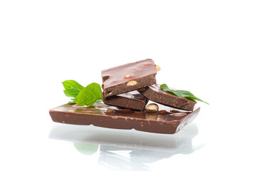 sweet dark chocolate with nuts on a white background