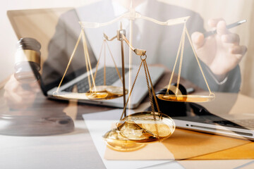 Business and lawyers discussing contract papers with brass scale on desk in office. Law, legal...