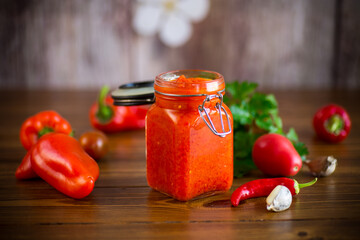 fresh natural homemade sauce made of peppers, tomatoes and other vegetables