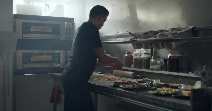 Process Of Pizza Preparation In Restaurant Kitchen