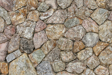 Rock wall was made from many big rocks, stone wall texture background, pattern stone style design decorative  real stone wall surface with cement.